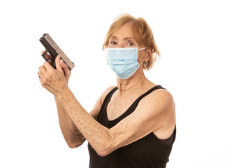 Woman with a pistol, ready to fire and wearing a mask on a white background.