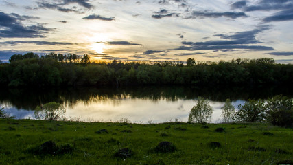 Mirror sunset over the river