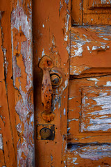 old rusty door broun color with peeling paint