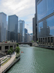 Fototapeta na wymiar Chicago river flowing through skyscraper buildings downtown