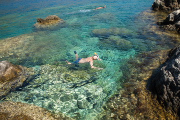 Naklejka na ściany i meble person snorkeling in the sea
