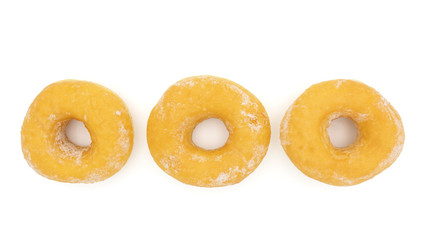 Three fresh donuts with powered sugar isolated on white background