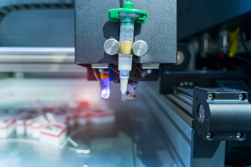 3D printer or additive manufacturing and robotic automation technology.