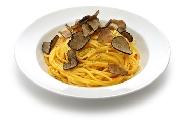 carbonara spaghetti with fresh black truffle isolated on white background