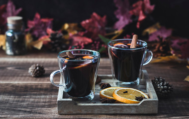 Cozy autumn drink. Hot mulled wine with oranges and spices.