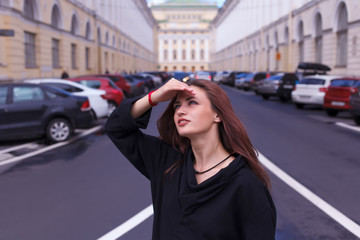 Obraz na płótnie Canvas Portrait of a girl tourist on the streets of St. Petersburg