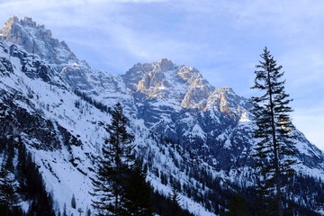 Winter mountain peaks beautifully illuminated by the evening light in valley of Val Fiscalina in Dolomites. Sexten Dolomites, South Tyrol, Italy