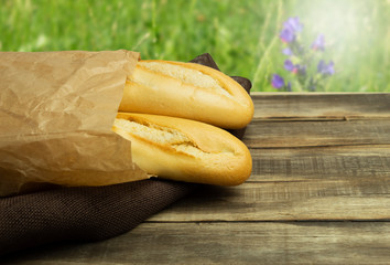 Fresh and crispy baguettes as a background for text