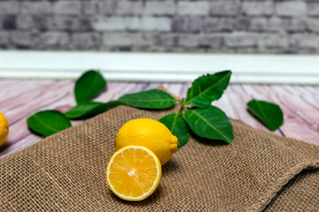 
Lemon with leaves on sackcloth