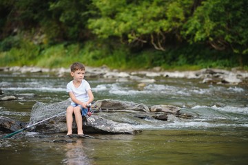 photo of little boy fishing