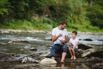 Fototapeta na wymiar Father and son together fishing