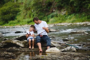 Father and son together fishing