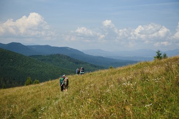 Fototapeta na wymiar Hiking team in the mountains. travel sport lifestyle concept