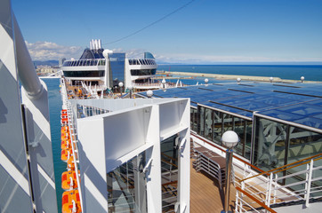 Sun deck with deck chairs, sun loungers or beds, whirlpool and bar on modern cruiseship or cruise...