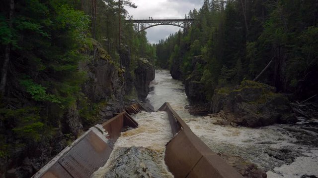 Storstupet Waterfalls in Dalarna, Deep Canyon and Narrow Bridge Railway, Slow Motion
