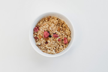 Muesli bowl on white background.