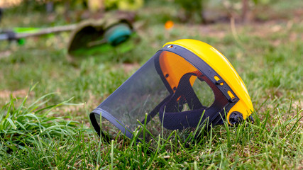 Protective mask for mowing the grass and a trimmer in the garden on the grass