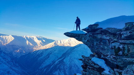 Fototapeta premium A skier and mountaineer in the snowy mountains, winter season 