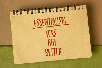 less but better - essentialism concept, handwriting in a spiral art sketchbook, lifestyle and personal development