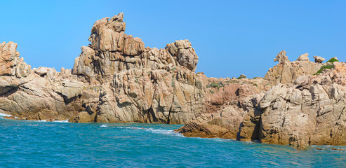 Beautiful shot of rock formations near the sea close to Beach Li Cossi, Sardinia, Italy.
