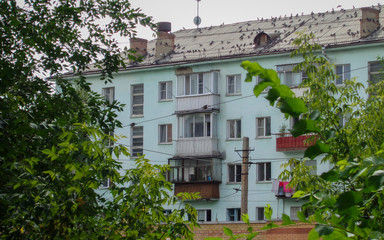 Fototapeta na wymiar Soviet apartment building. Apartment block. Soviet architecture. Old residential area. Ust-Kamenogorsk (Kazakhstan)