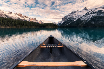 Canoeing with Canadian Rockies in Spirit Island on Maligne Lake at Jasper national park