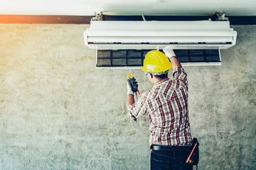 Technician - Engineer investigate Repairing Air Conditioner