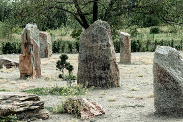 Tall stones standing close to each other.