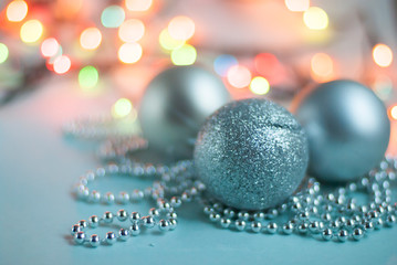 Christmas silver balls on the Christmas tree. Christmas toy close-up on the background of a...