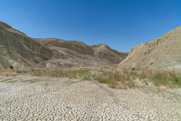 Climate change drought land. Dried riverbed of a mountain river