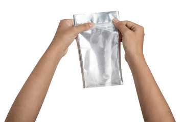 Hand with Foil package bag isolated on white
