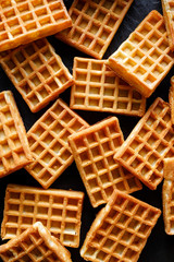 Waffles of rectangular shape on a black background top view