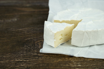 fresh cheese on a wooden background