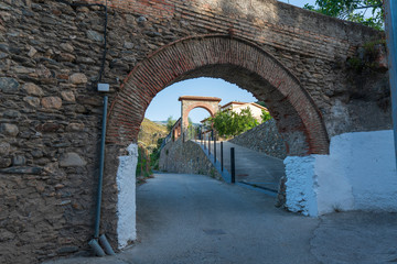 Fototapeta na wymiar An ancient arch and a modern arch
