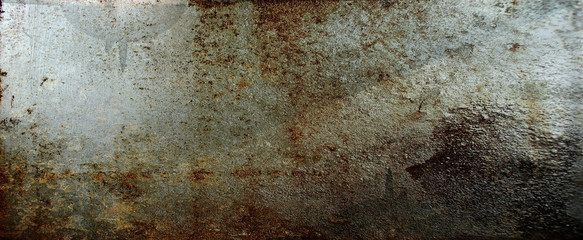 Brown peeling paint on the wall. Old concrete wall with cracked flaking paint. Weathered rough painted surface with patterns of cracks and peeling. High resolution texture for background and design.