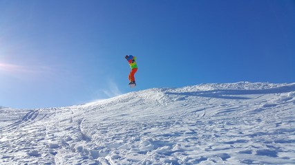 Naklejka na ściany i meble young skier skiing on the mountain and winter season, snow sale, ski resort 