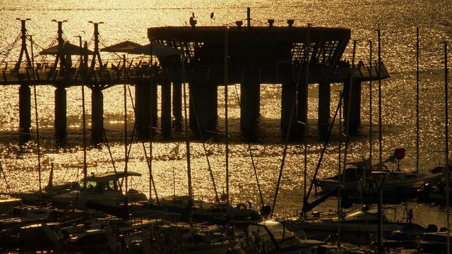 View on the pier and marinaon the Vistula river at sunset in Plock, Poland