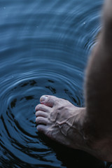 foot on the cold water