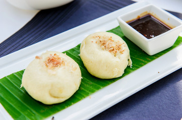 Japanse cuisine, squid on plate with soy sauce for lunch menu