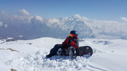 a young skier skiing on the mountain, winter season and snow landscape
