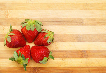 strawberries fruit isolated on wooden board