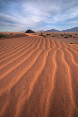 Sand Dune Lines leading to Distant Mountain