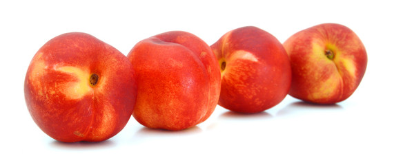sweet peaches on a white background 