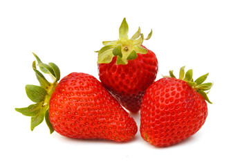 Three strawberry isolated on a white background, macro image