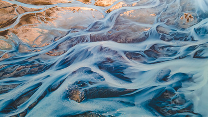 A glacial rivers from above. Aerial photograph of the river streams from Icelandic glaciers. Beautiful art of the Mother nature created in Iceland. Wallpaper background high quality photo - 373760861