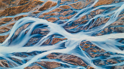 A glacial rivers from above. Aerial photograph of the river streams from Icelandic glaciers. Beautiful art of the Mother nature created in Iceland. Wallpaper background high quality photo - 373762445