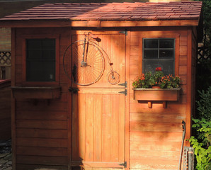 Wooden shed door with antique bicycle
