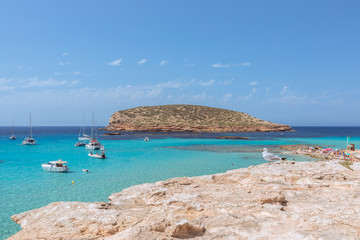 The purest emerald water off the coast of  Cala Comte, beach Cala Escondida. Ibiza, Balearic Islands. Spain