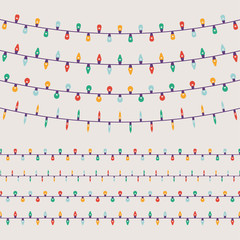 Lovely set of simple vector limited colours flat design Christmas lights garlands with light bulbs of different shapes and forms. Ideal for Xmas winter holiday season graphic and web design