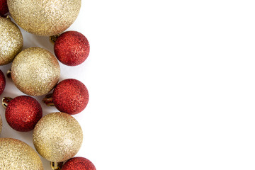 Gold and red sparkling christmas balls isolated on white background